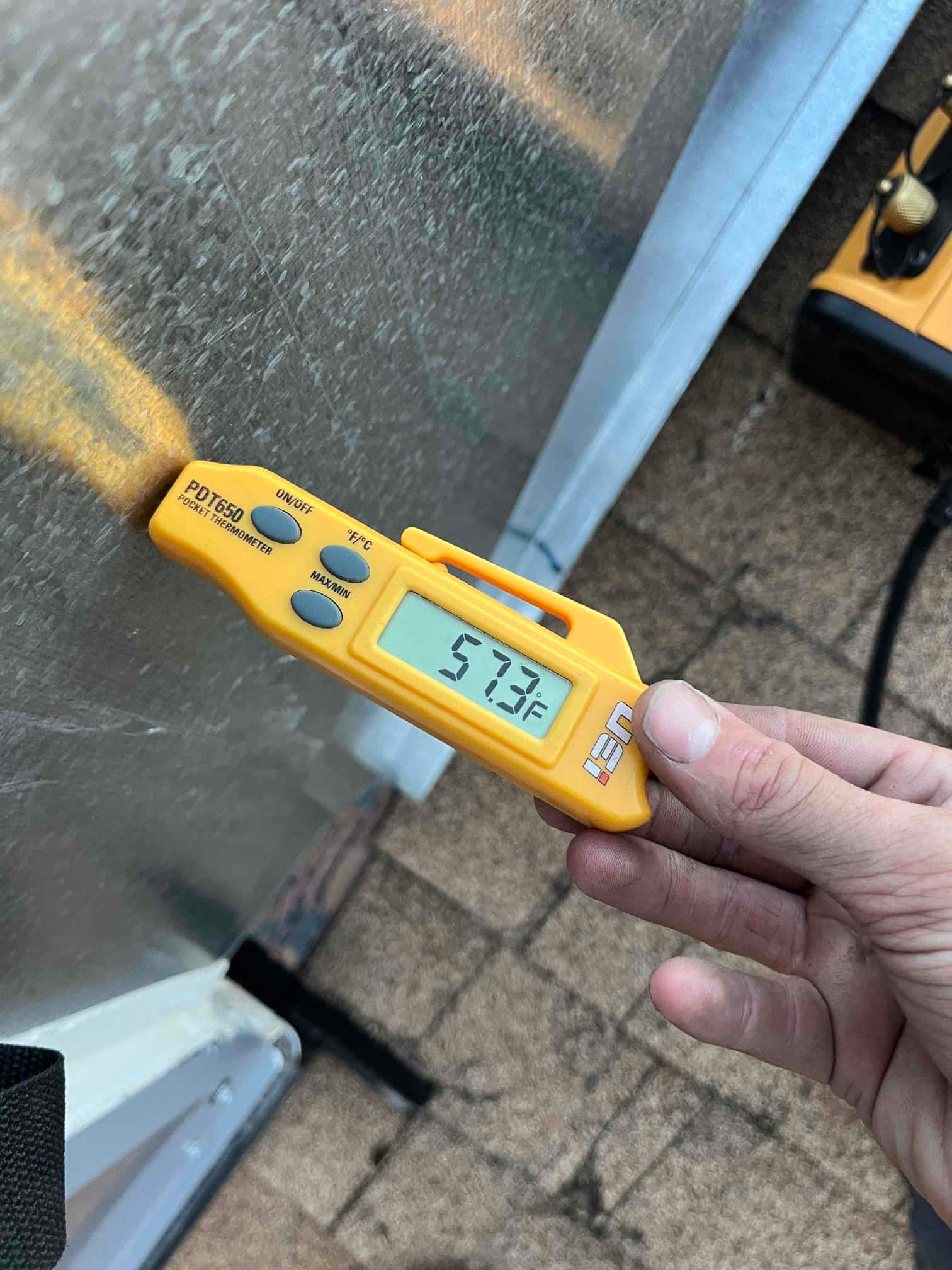 Diagnostic instrument display shows 57.3 °F.