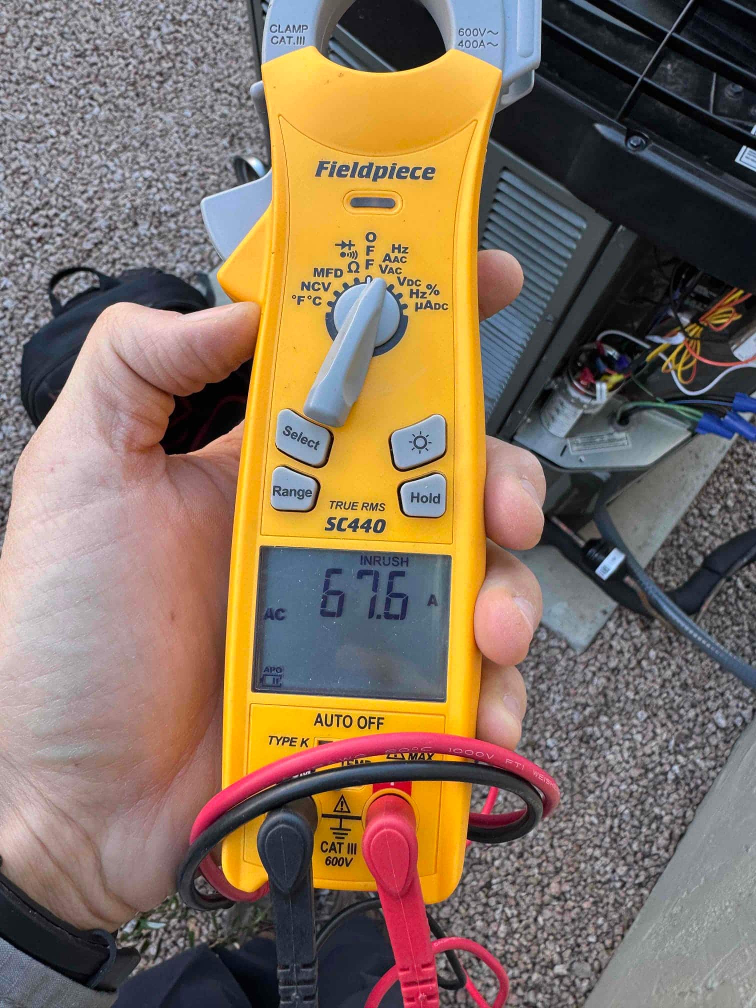 Diagnostic instrument display shows 67.6 A.