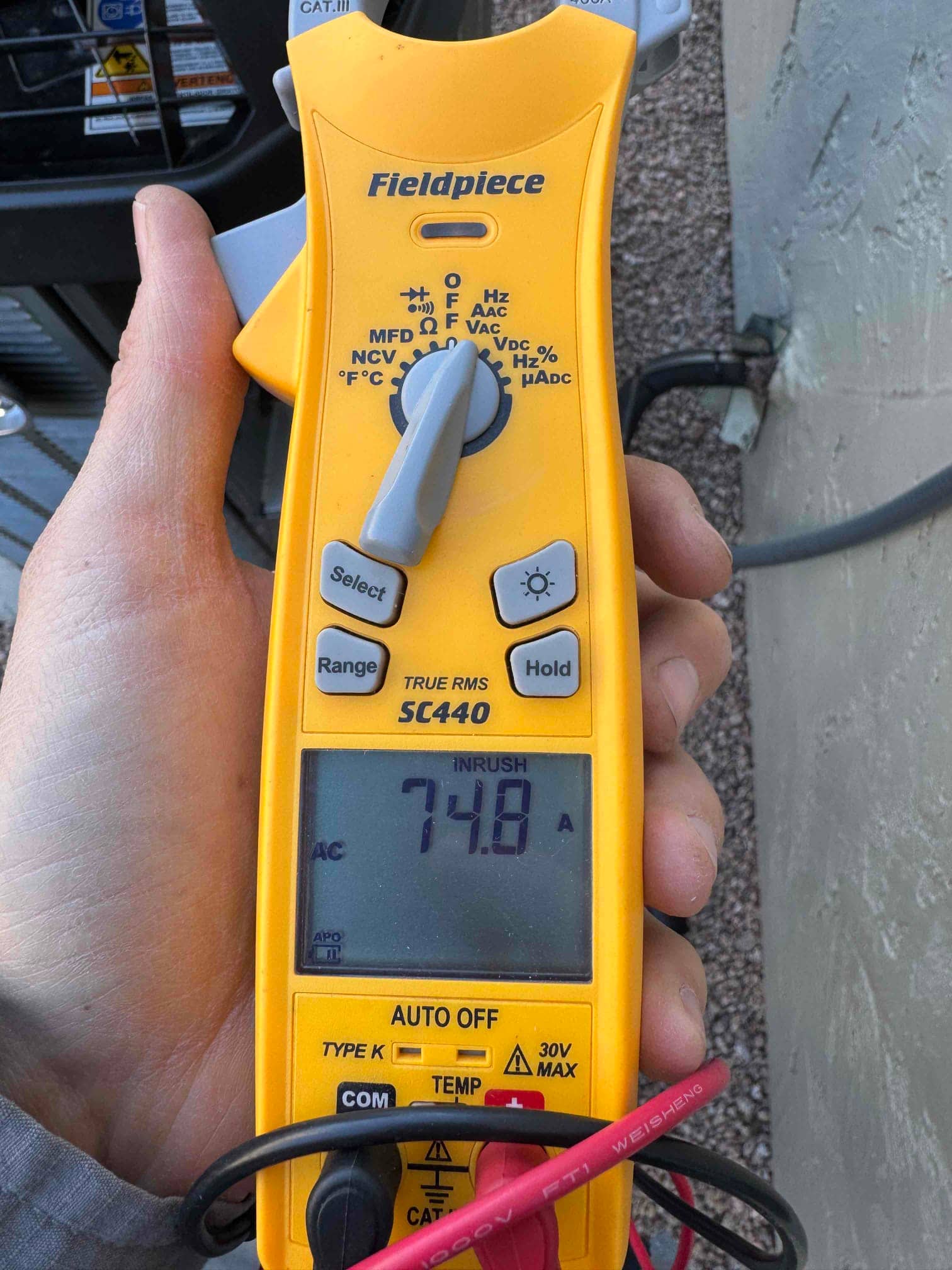Diagnostic instrument display shows 74.8 A.