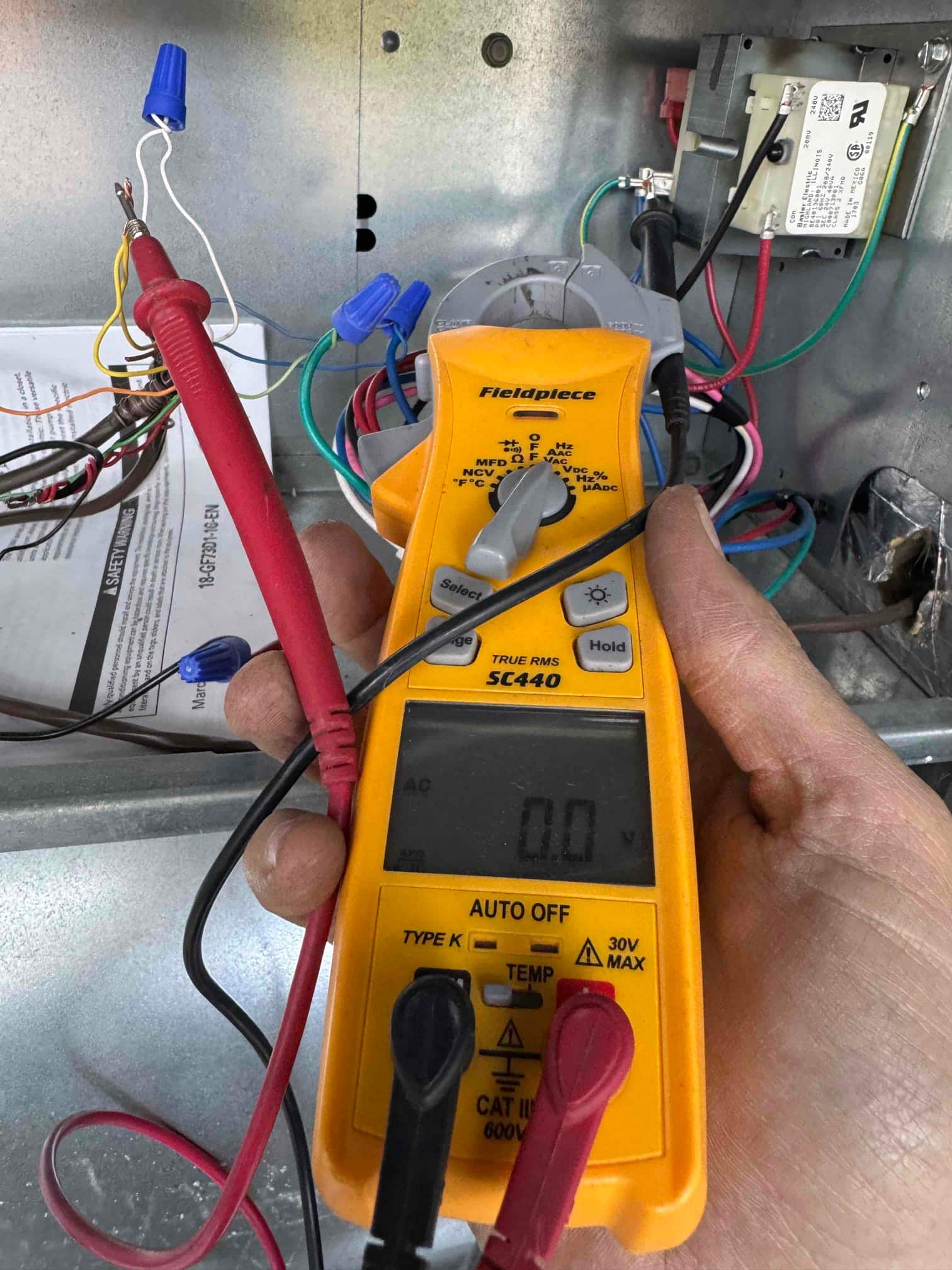 Diagnostic instrument display shows 0 V.