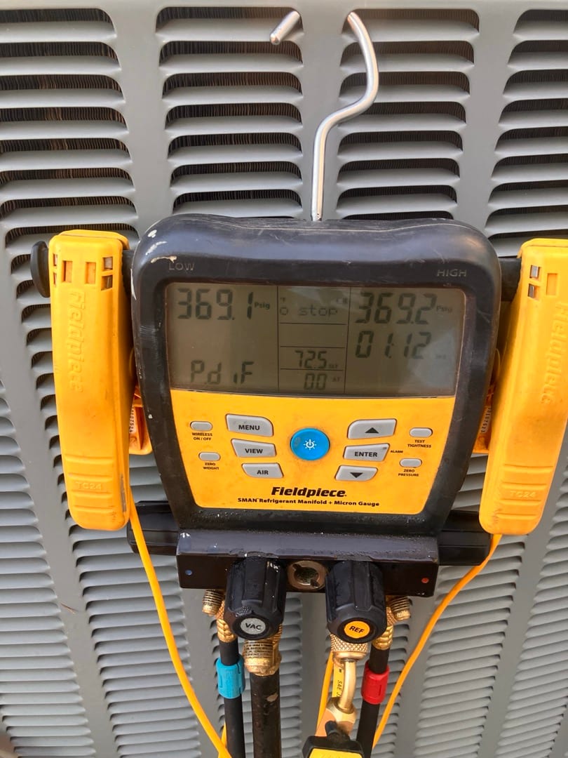 Digital manifold shows equal pressures around 369 PSI on both sides during a nitrogen pressure test of the new system.