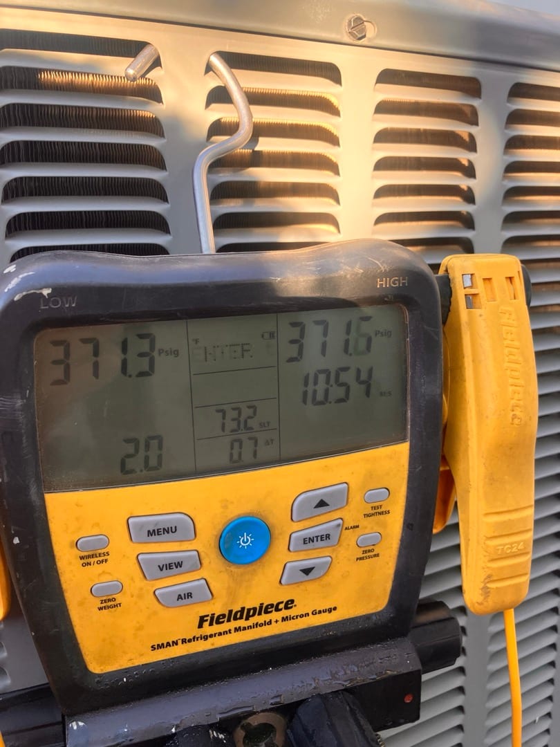 Digital manifold shows equal pressures around 371 PSI on both sides during the nitrogen pressure test of the new system.