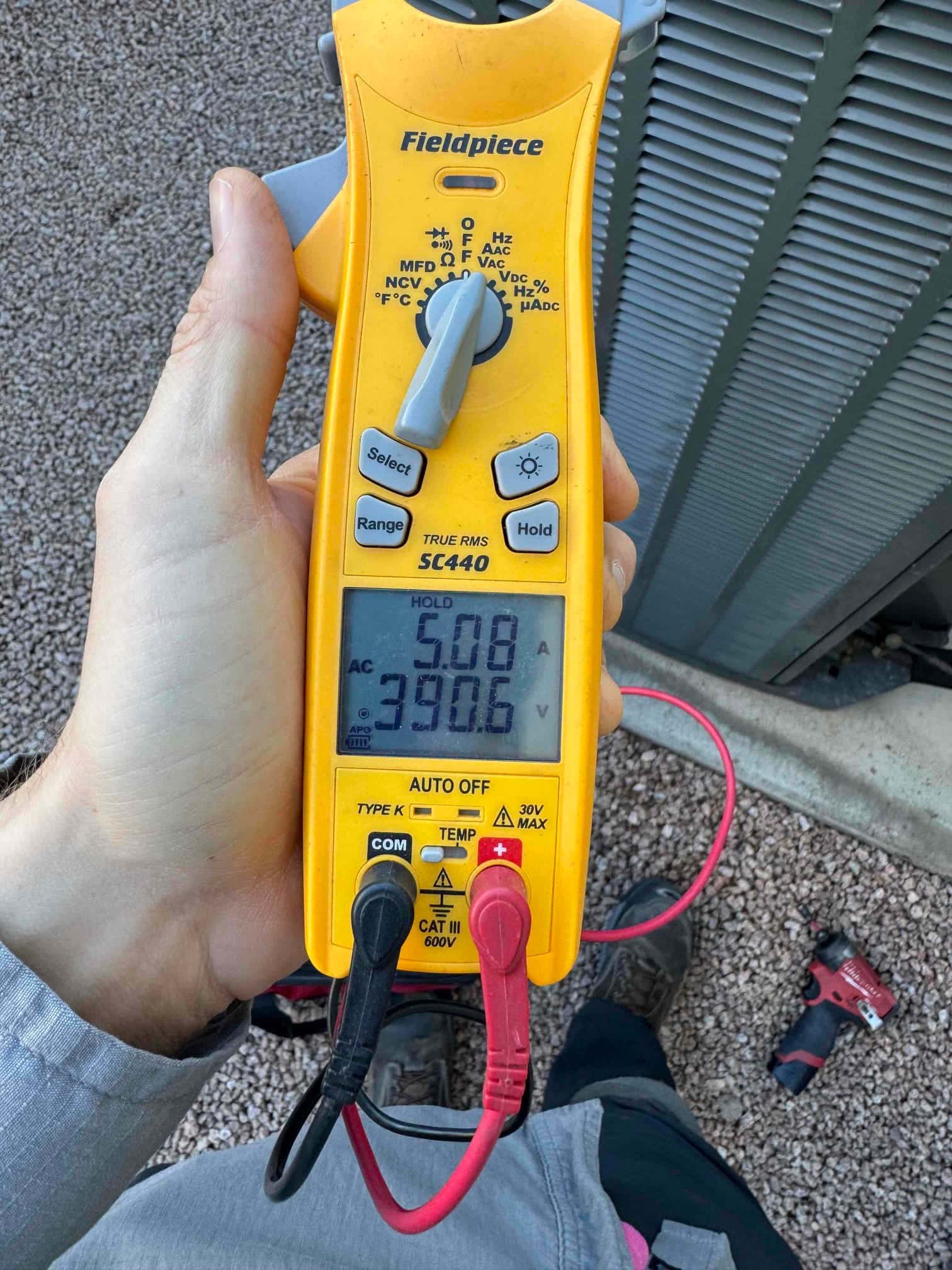 HVAC diagnostic instrument photographed during the service visit.