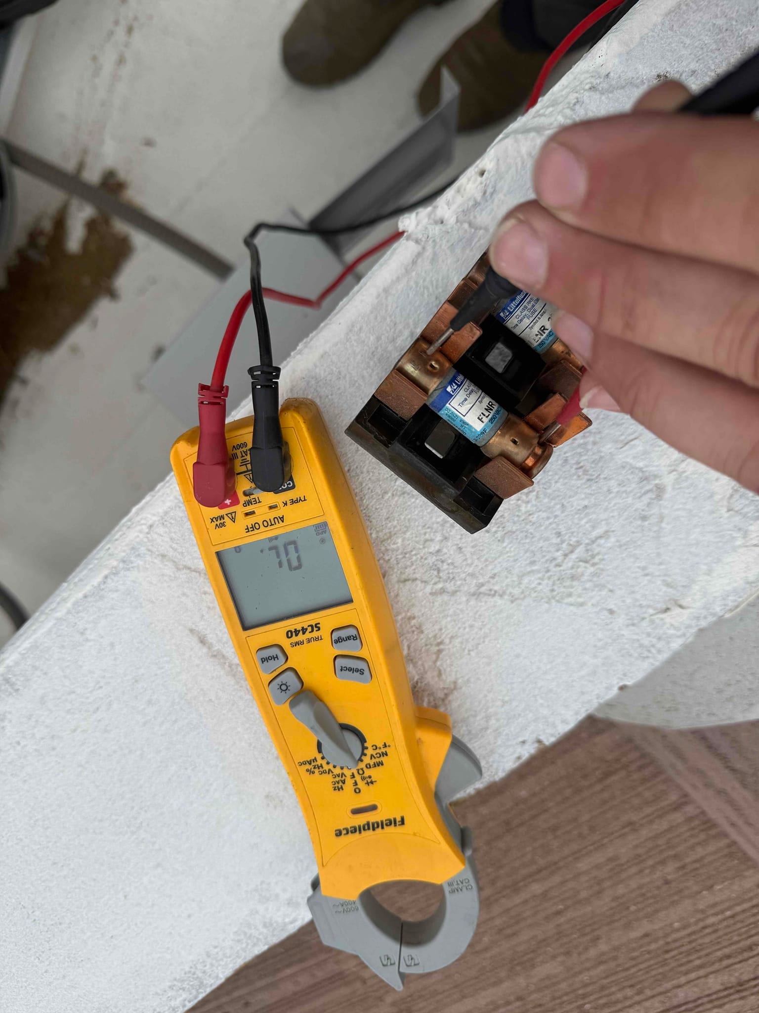 HVAC diagnostic instrument photographed during the service visit.