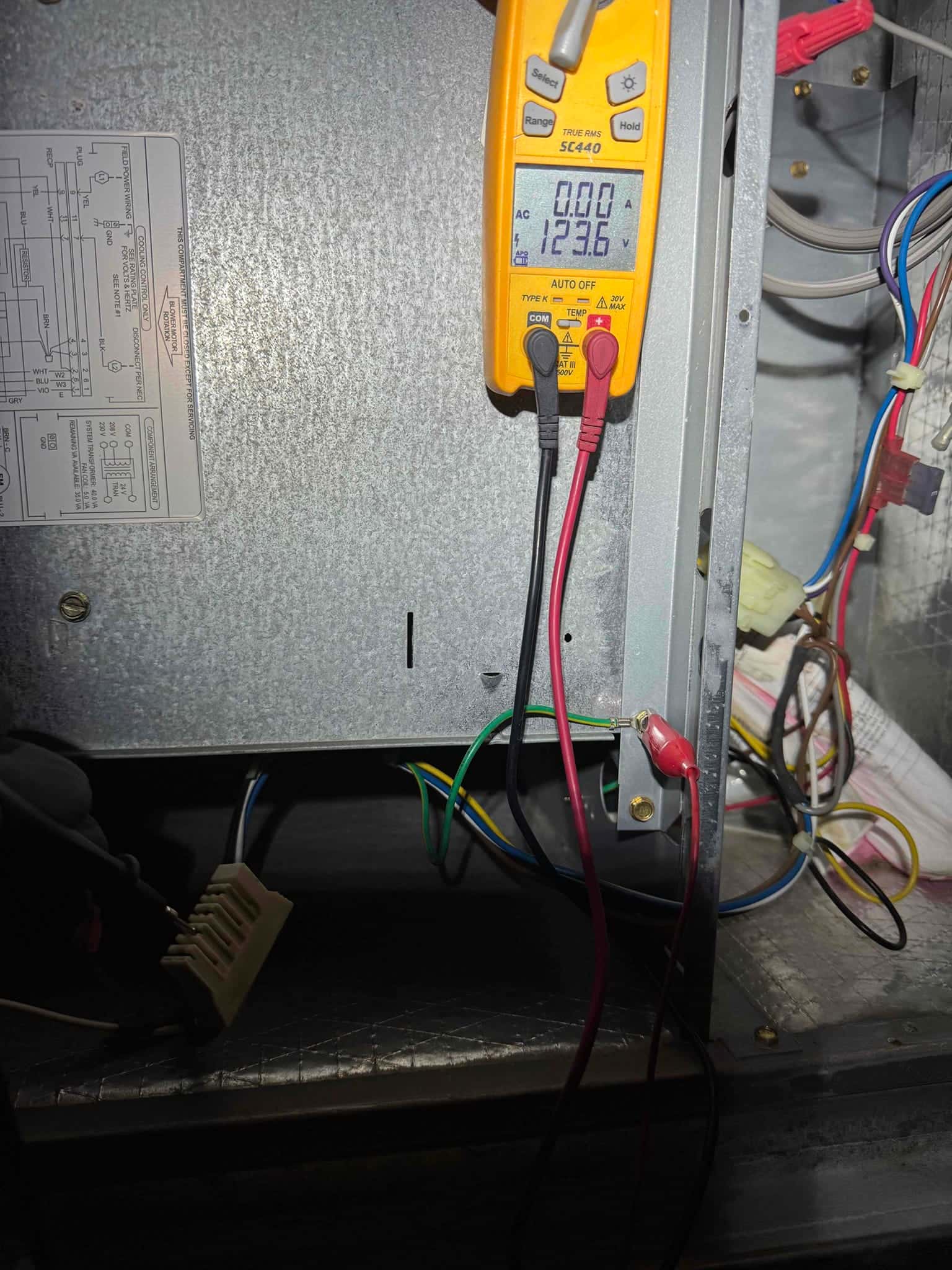 HVAC diagnostic instrument photographed during the service visit.