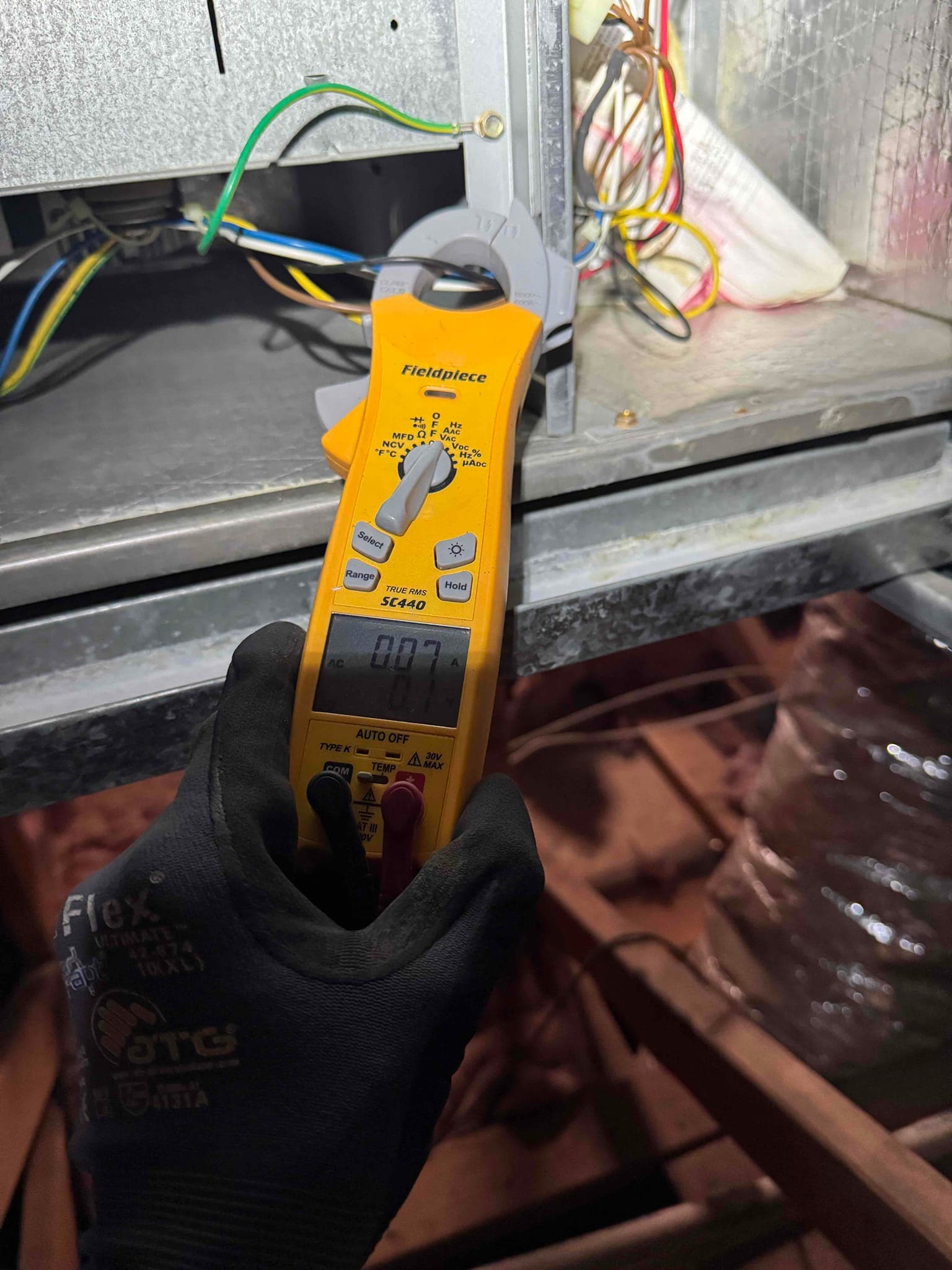 HVAC diagnostic instrument photographed during the service visit.