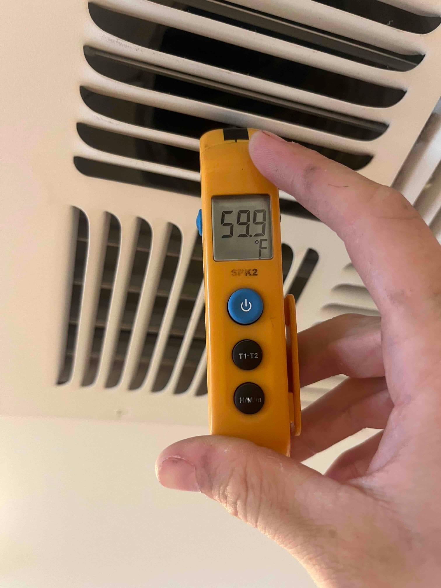 HVAC diagnostic instrument photographed during the service visit.