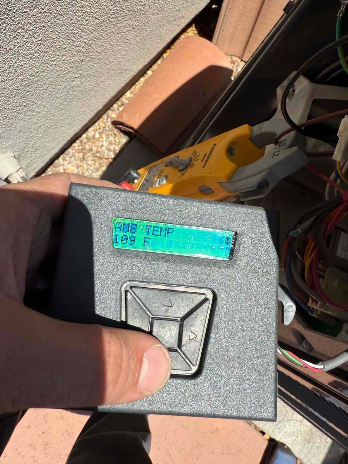 HVAC diagnostic instrument photographed during the service visit.