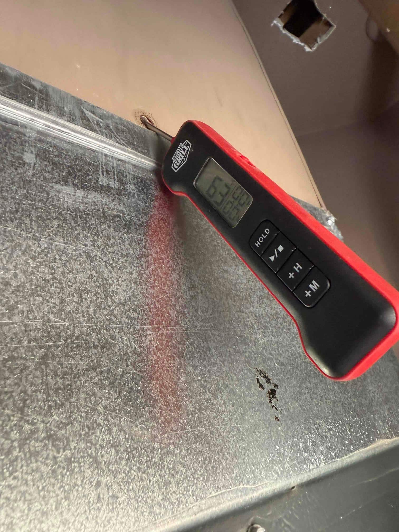 HVAC diagnostic instrument photographed during the service visit.