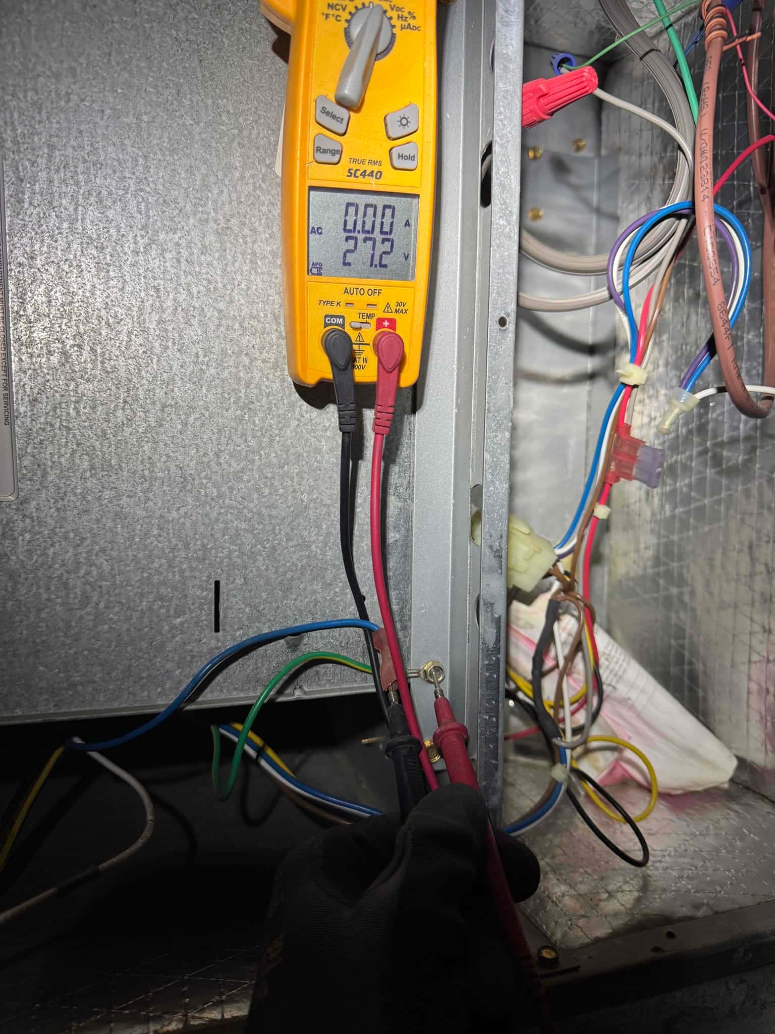 HVAC diagnostic instrument photographed during the service visit.