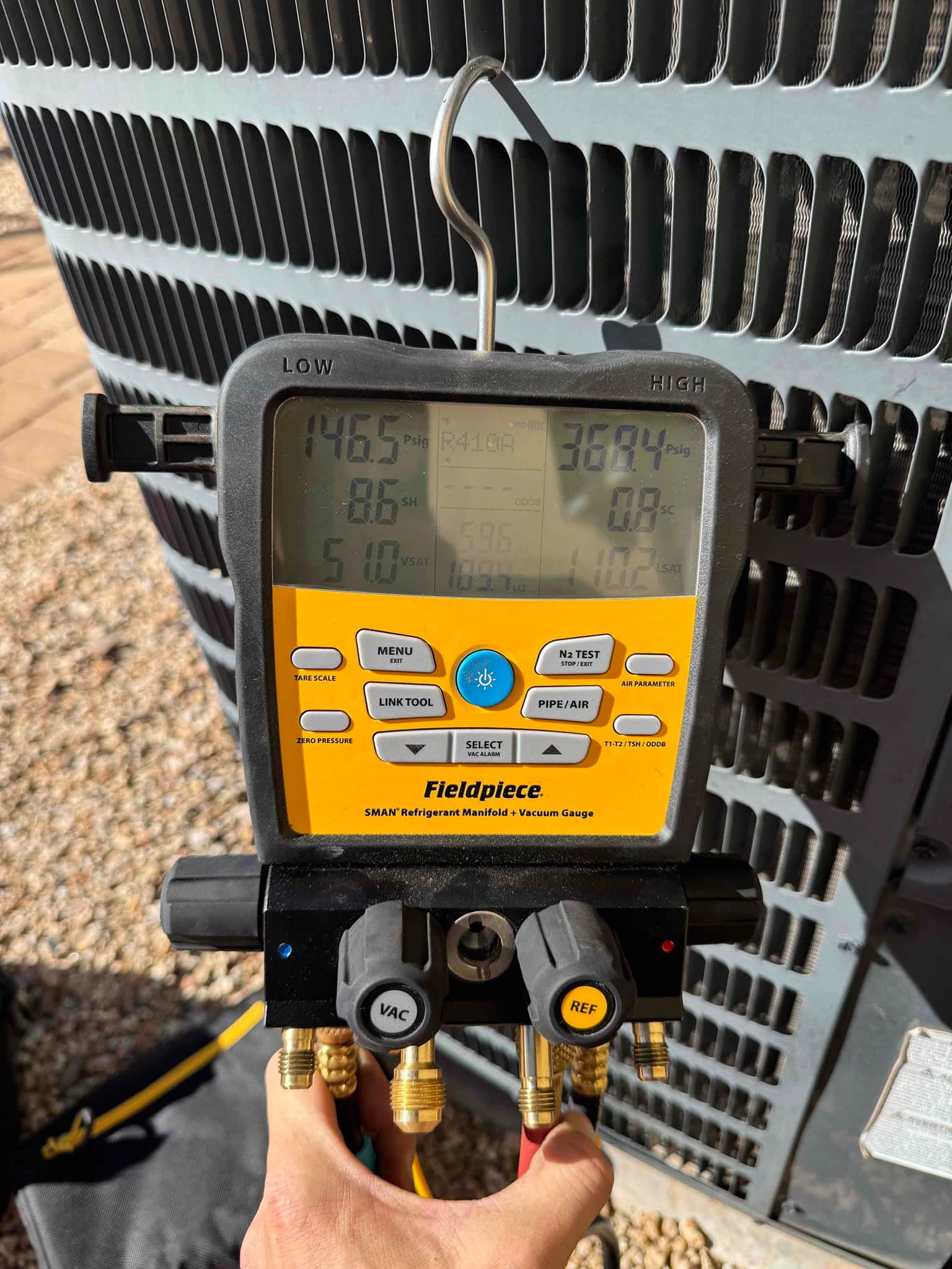 HVAC diagnostic instrument photographed during the service visit.
