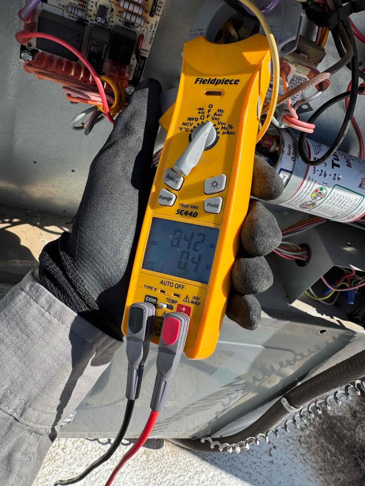 HVAC diagnostic instrument photographed during the service visit.
