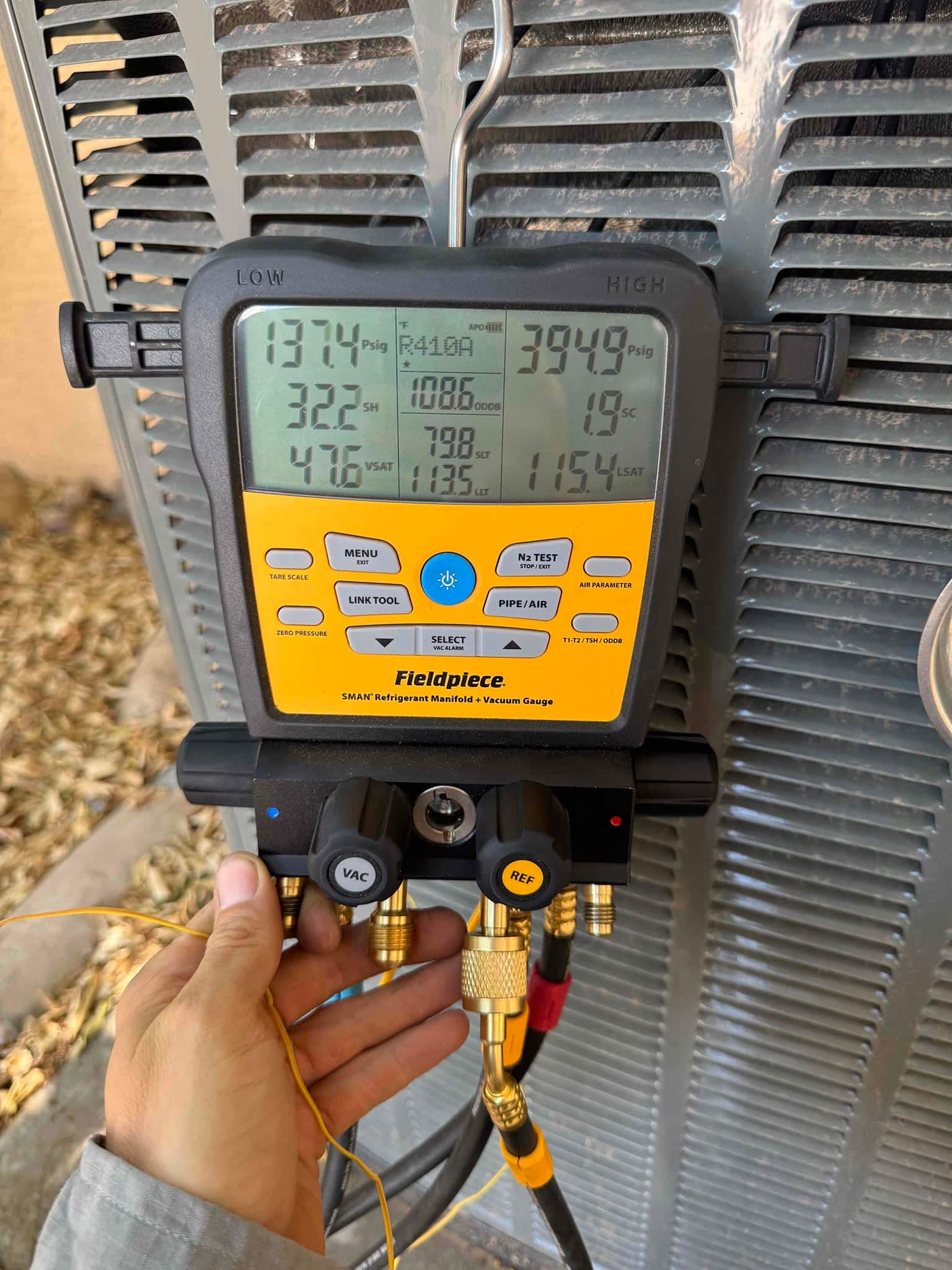 HVAC diagnostic instrument photographed during the service visit.