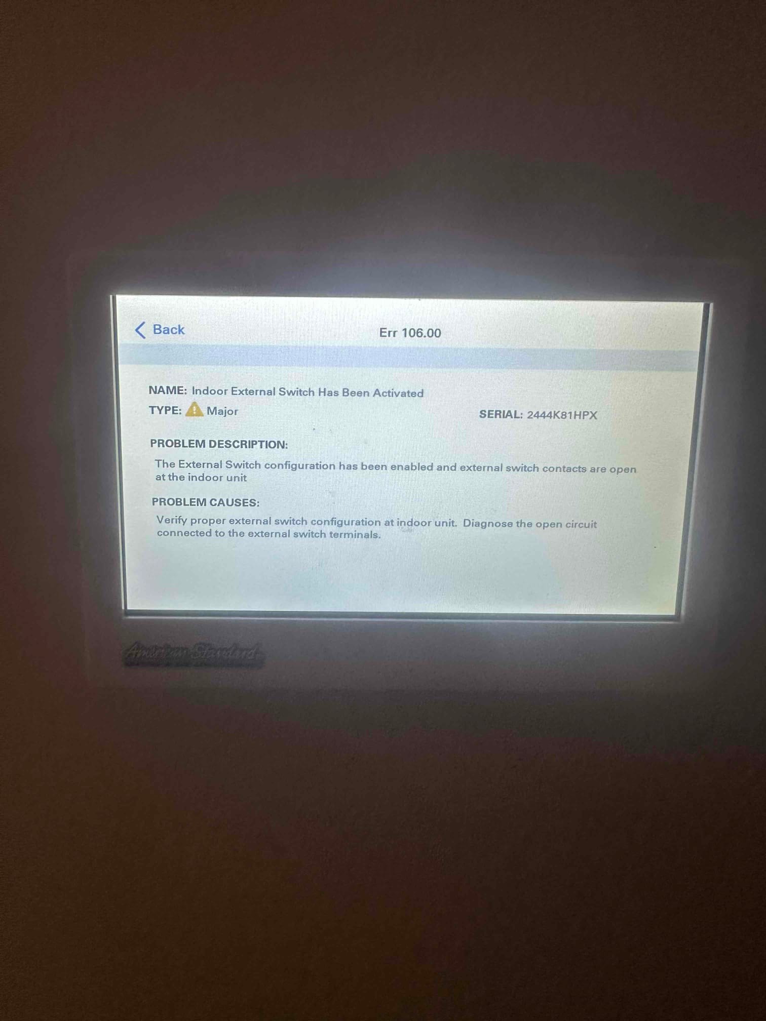 Thermostat touchscreen displays Err 106.00 with message about indoor external switch configuration and open contacts.