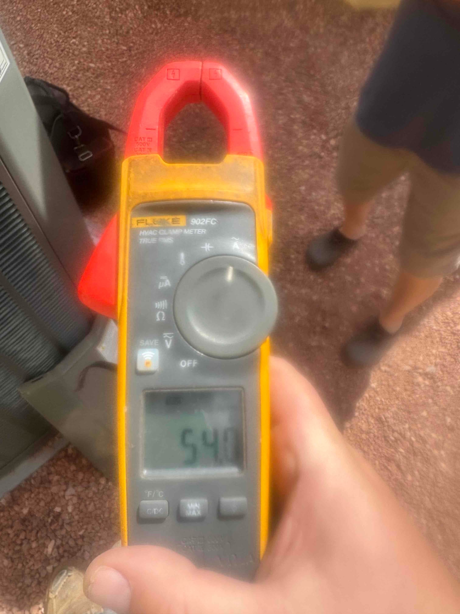 HVAC diagnostic instrument photographed during the service visit.
