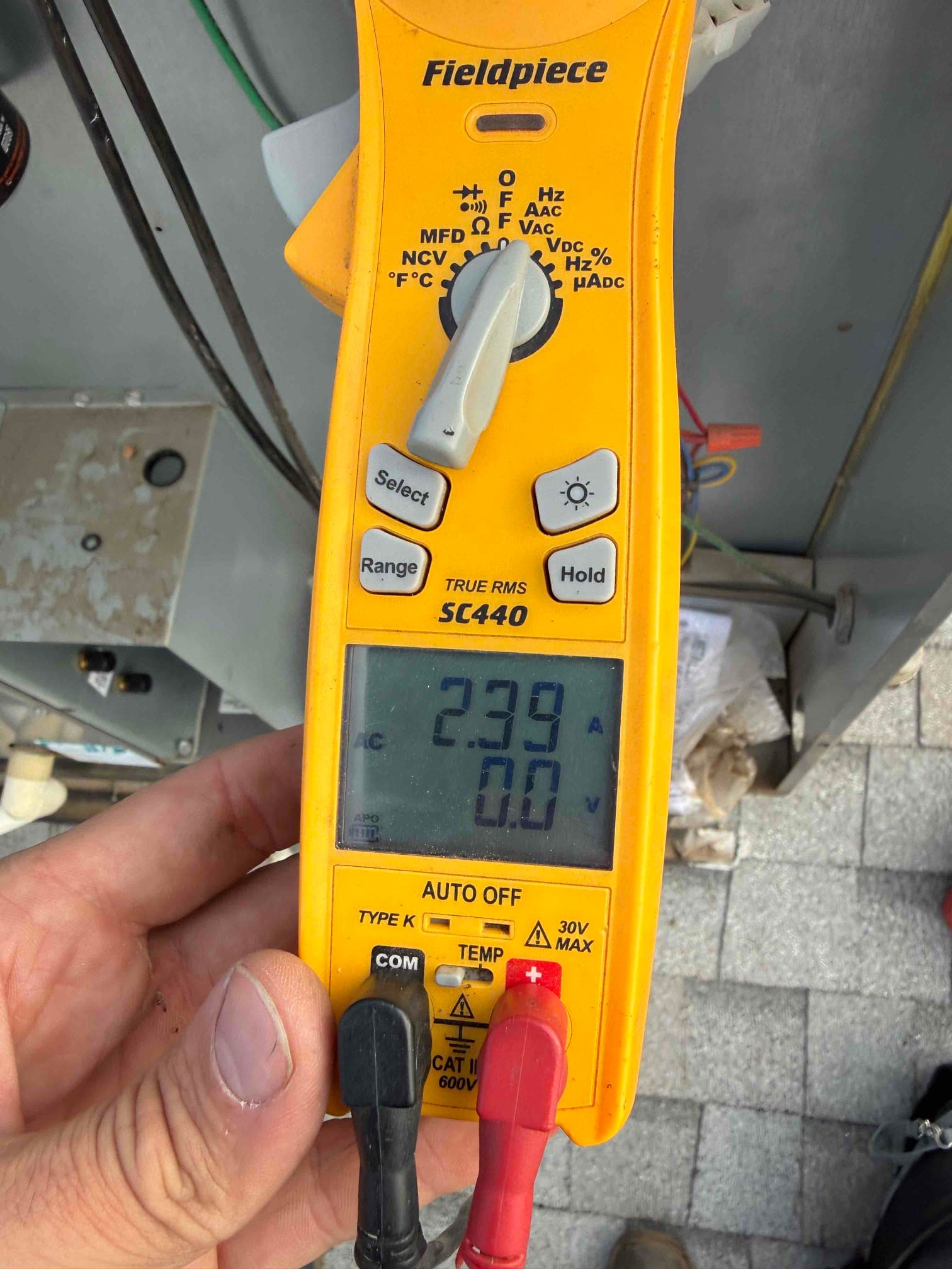 HVAC diagnostic instrument photographed during the service visit.