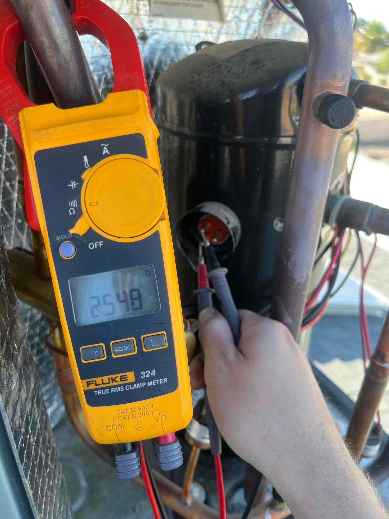 HVAC diagnostic instrument photographed during the service visit.