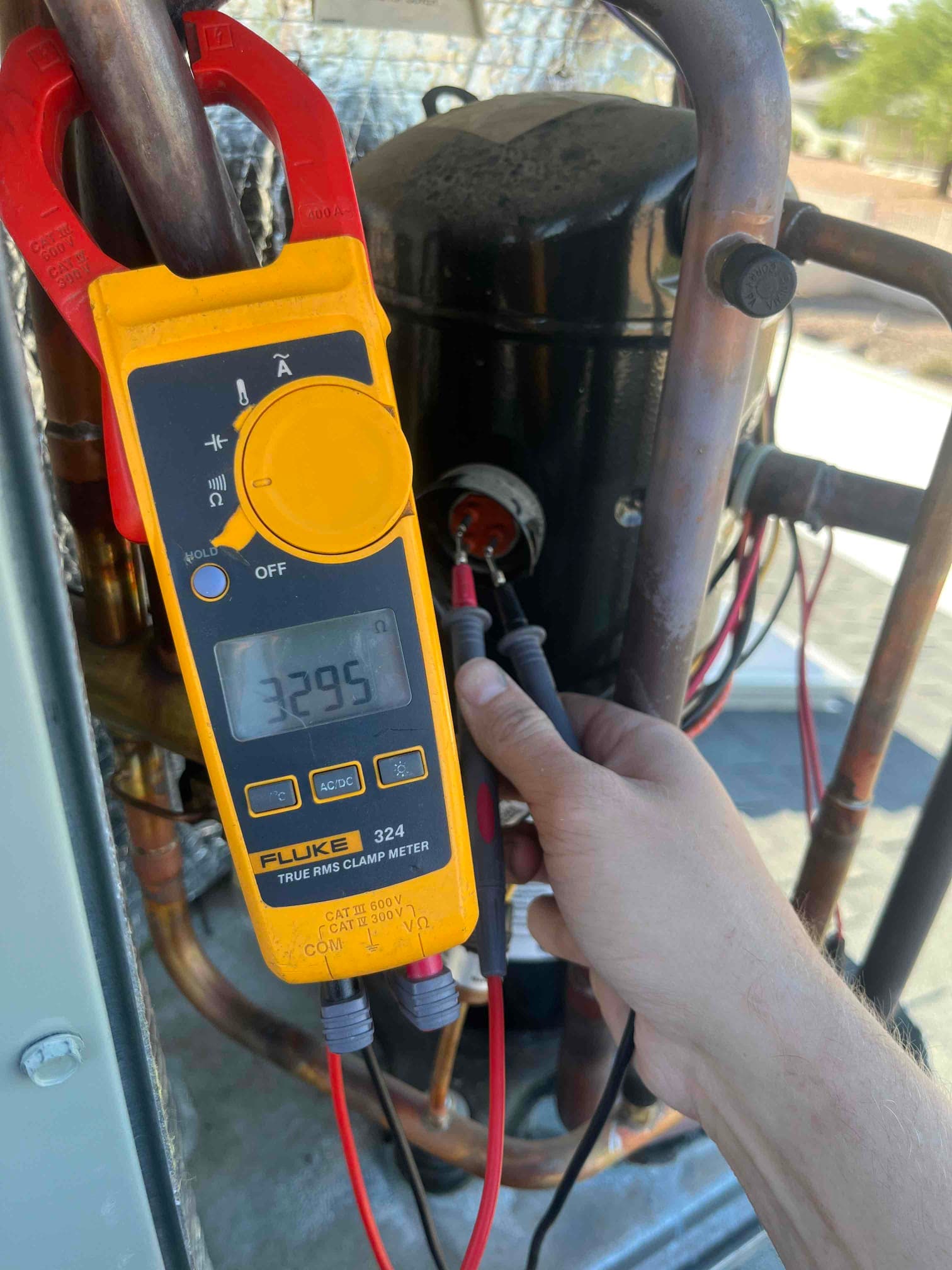 HVAC diagnostic instrument photographed during the service visit.