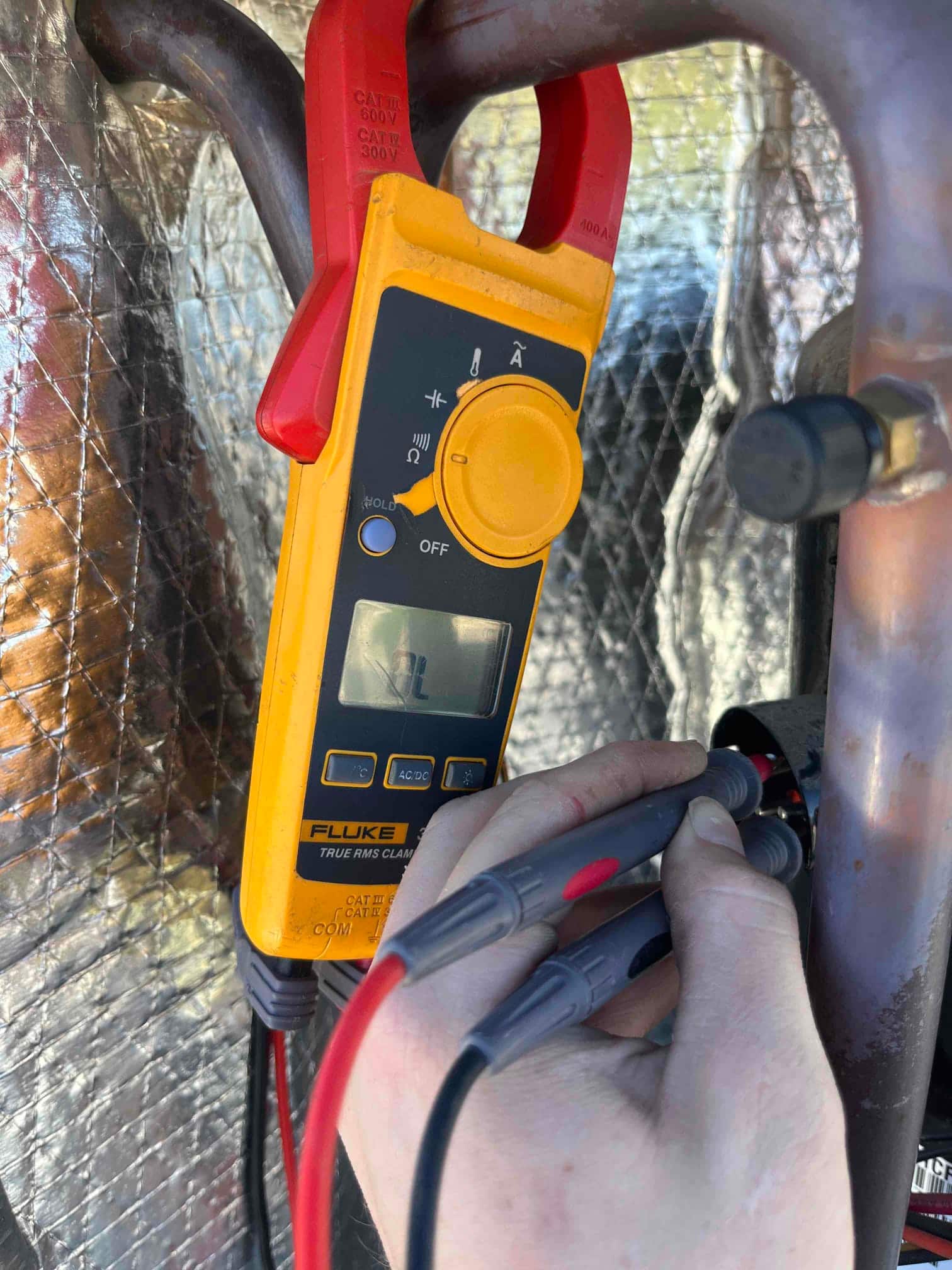 HVAC diagnostic instrument photographed during the service visit.