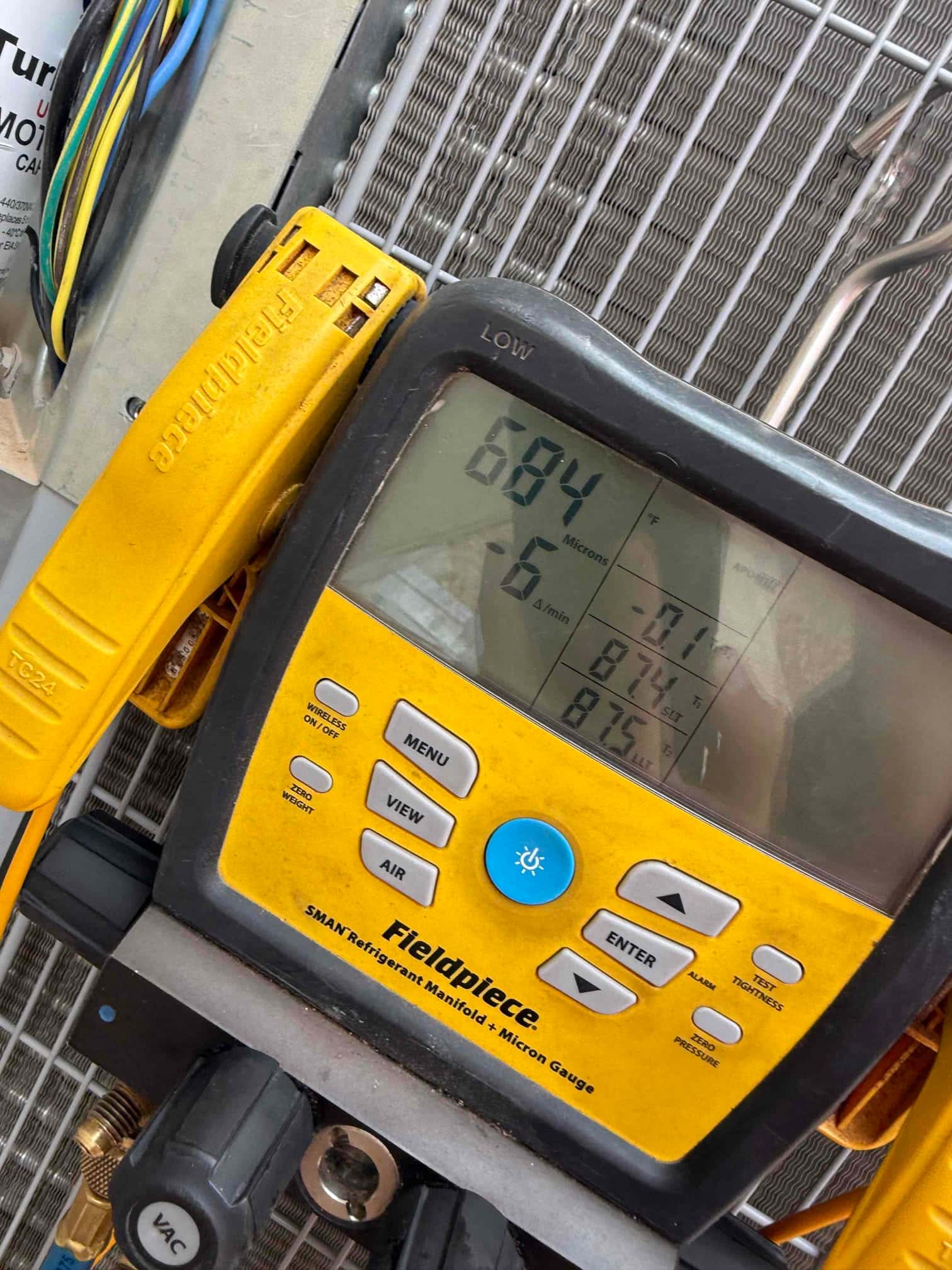 Diagnostic instrument display shows 684 microns.