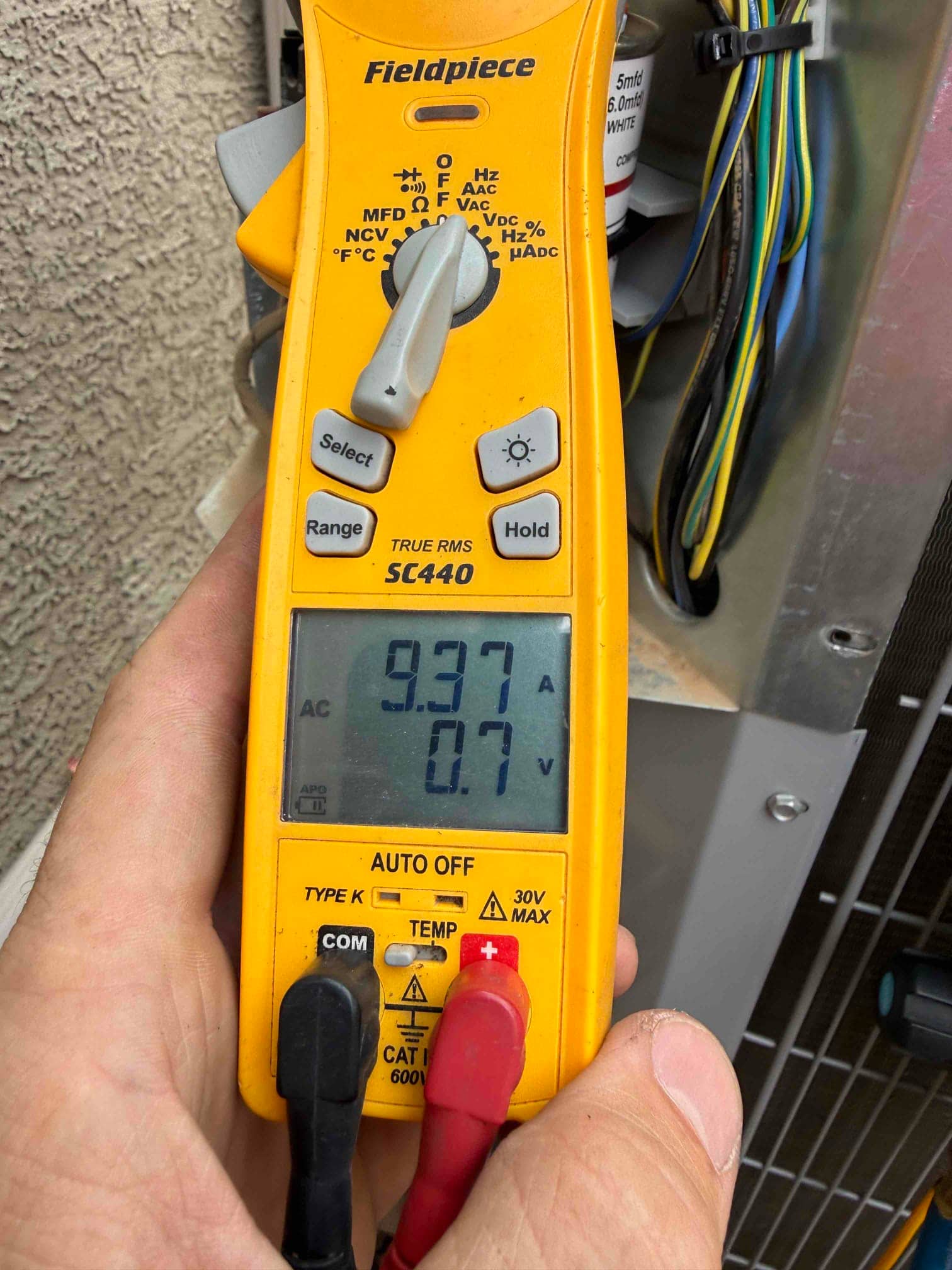 HVAC diagnostic instrument photographed during the service visit.