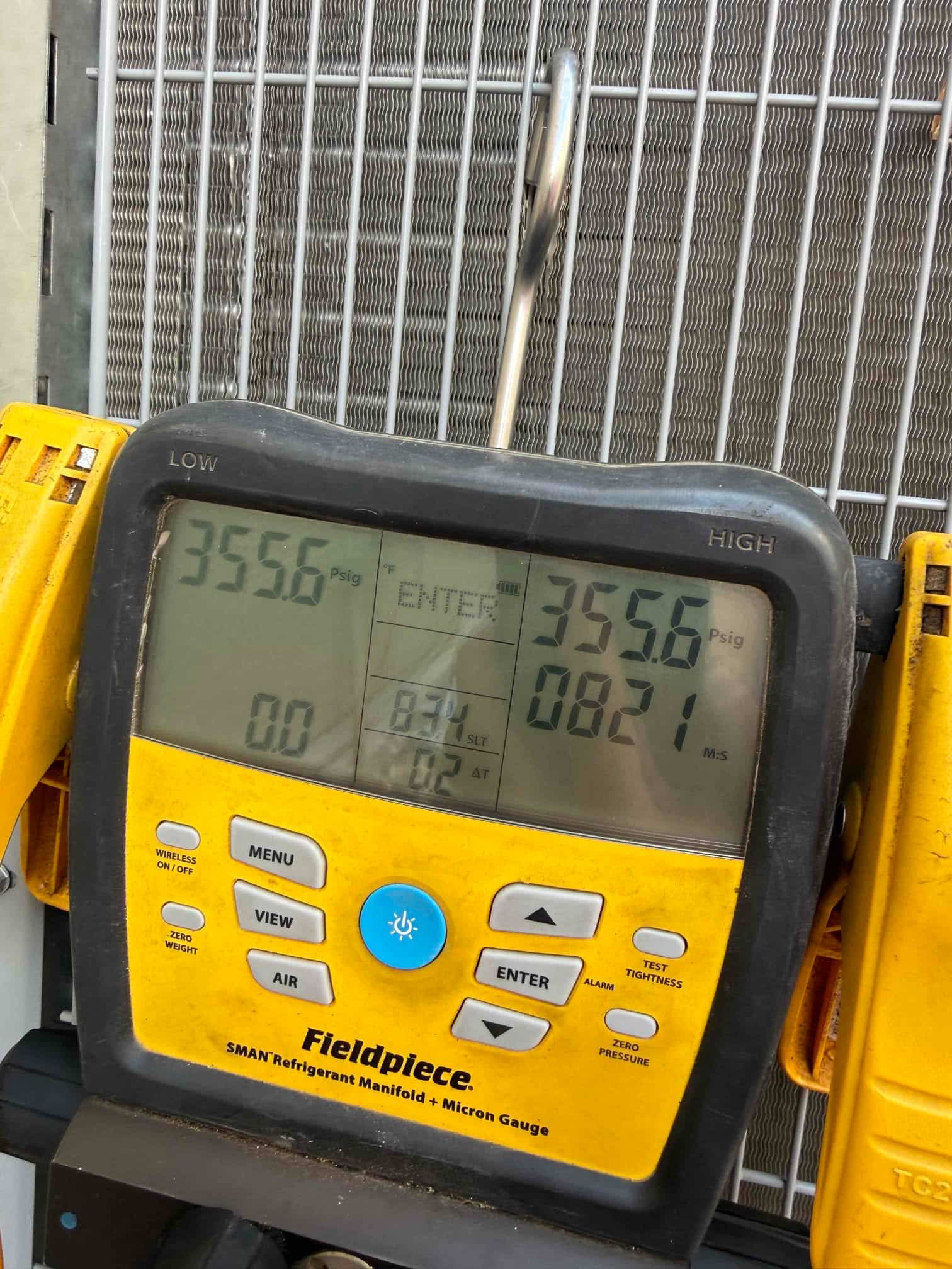 HVAC diagnostic instrument photographed during the service visit.