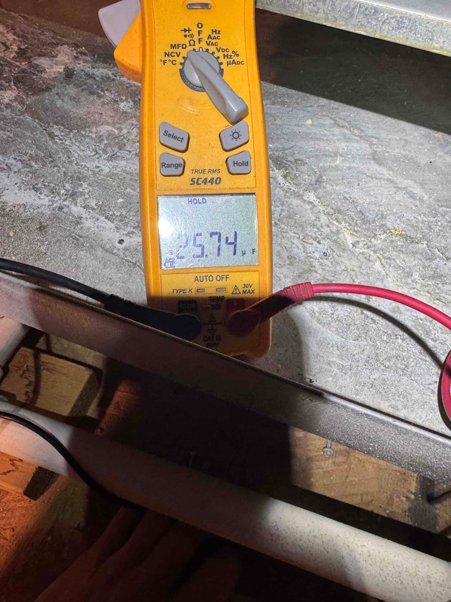Diagnostic instrument display shows 25.74 μF.